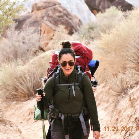 Vanessa hiking in an arid area
