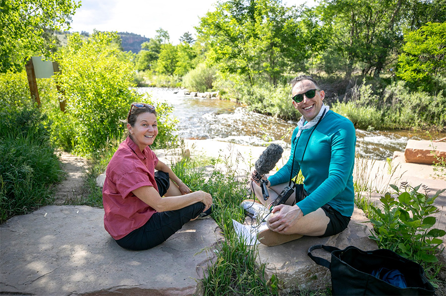 Dana Watts and Ryan Warner sitting on a rock in Bohn Park in Lyons, CO